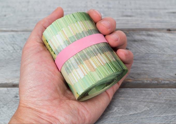 rouleau d'argent canadien illustrant combien peut coûter cher une hypothèque légale