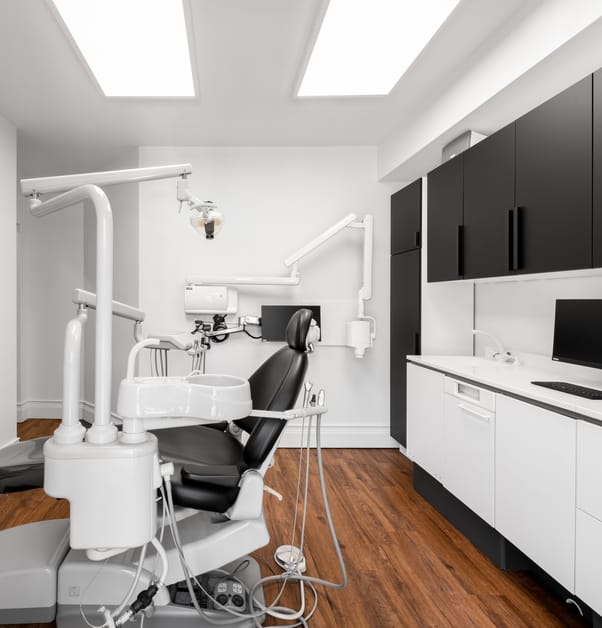 Newly renovated dental clinic treatment room, with black and white cabinets