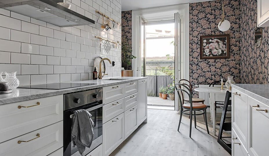 small kitchen with floral patterned wallpaper