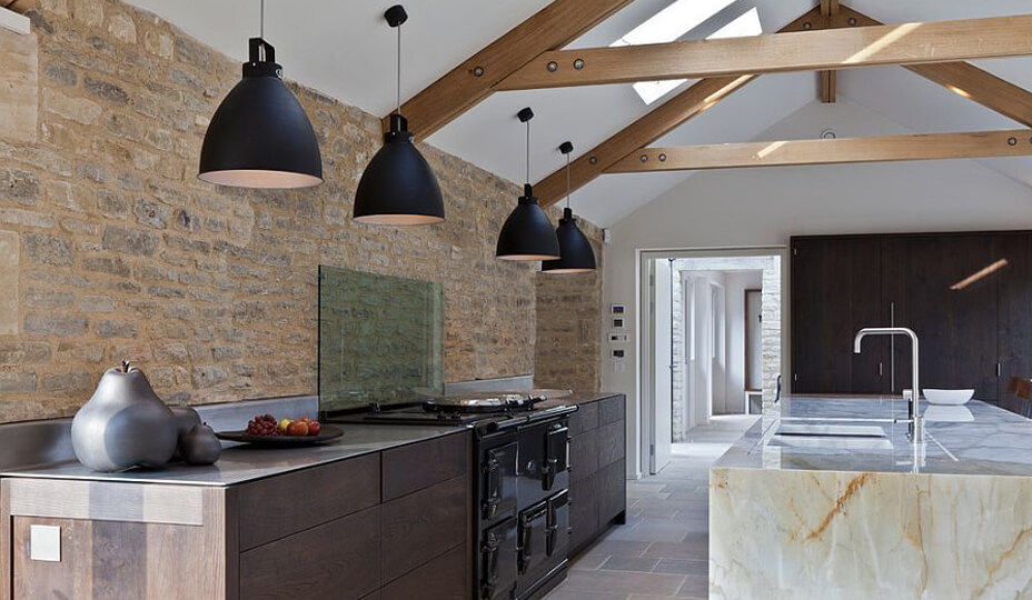 rustic kitchen with brick wall, wood beam and marble island