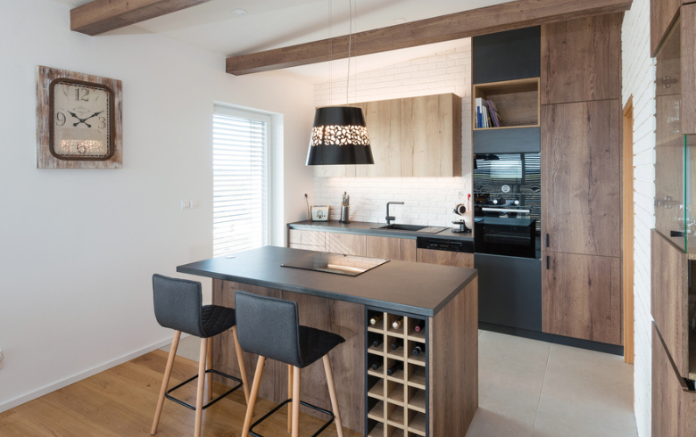 kitchen with wood cabinets and wood kithen island with black high chairs