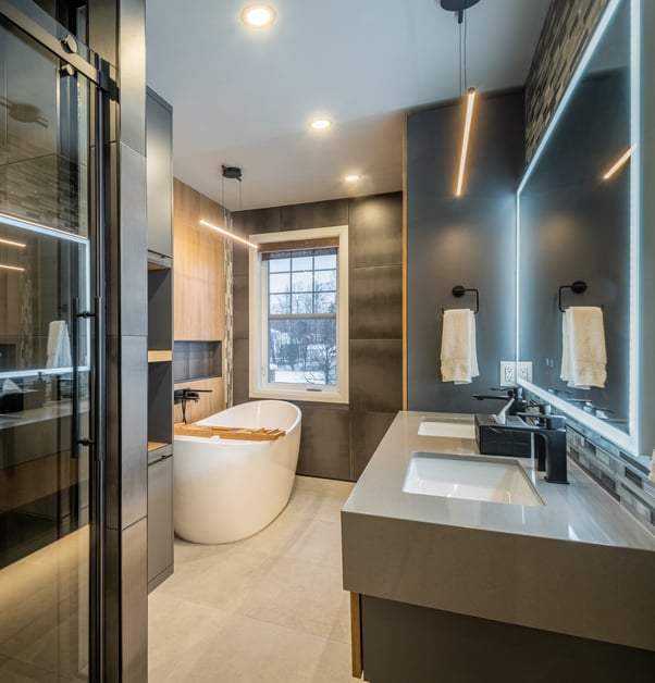 Modern bathroom with a smoky glass shower stall and large freestanding bathtub