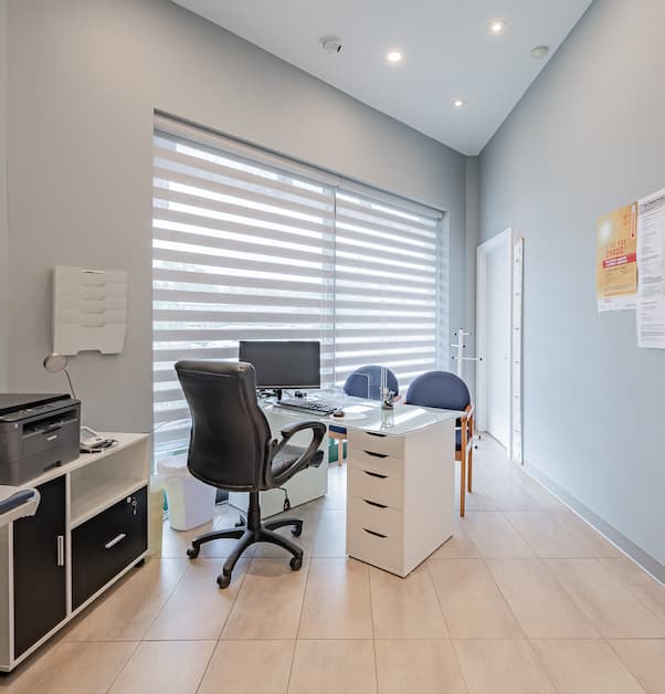 renovated private office with consultation area and large windows