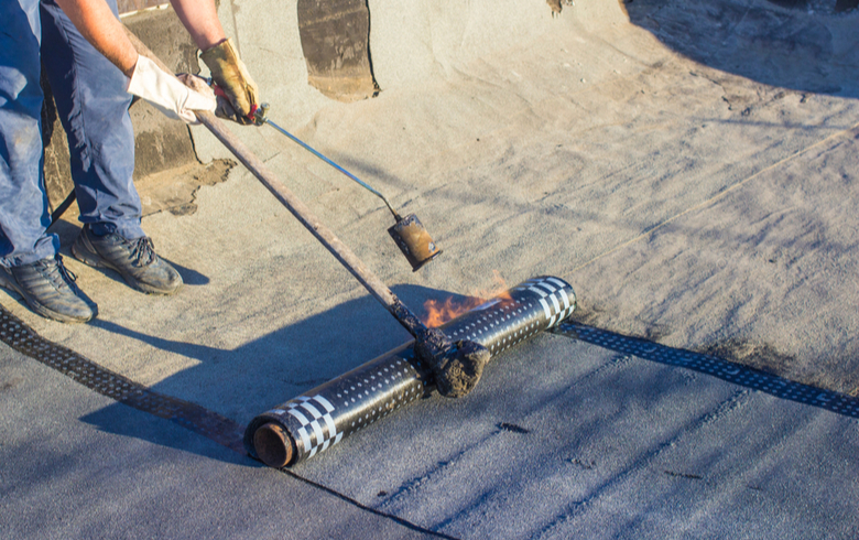 elastomeric roofing applied with a torch on a flat roof