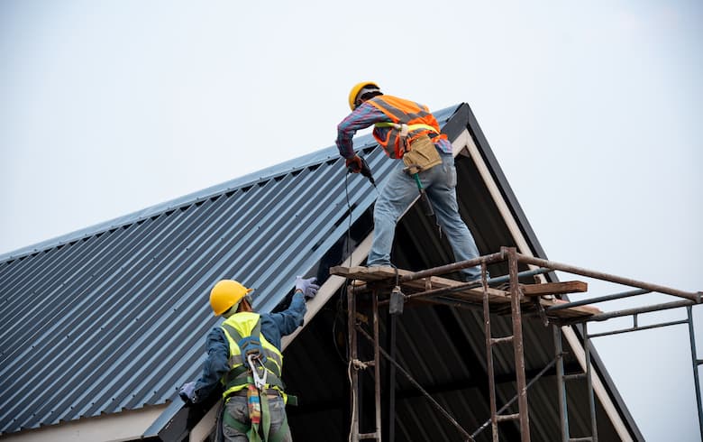 roofing workers installing a pitched roof
