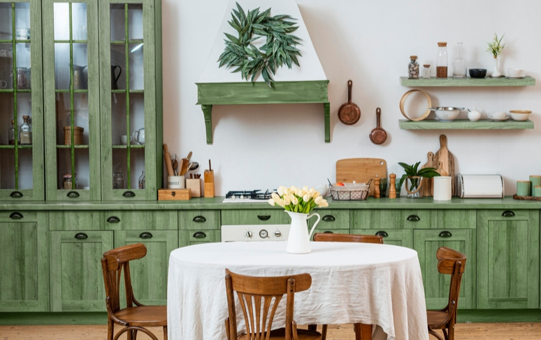 vintage style kitchen with green aged cabinets