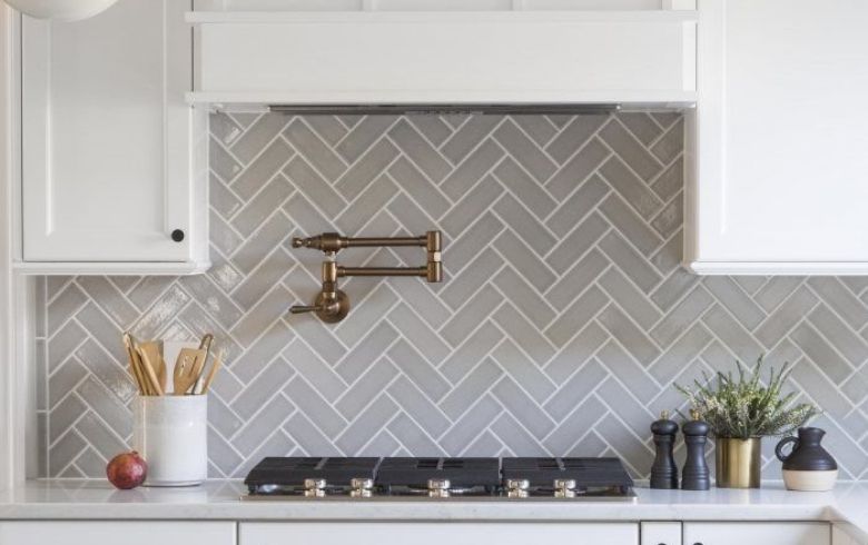 kitchen with grey tiles arranged in chevron pattern