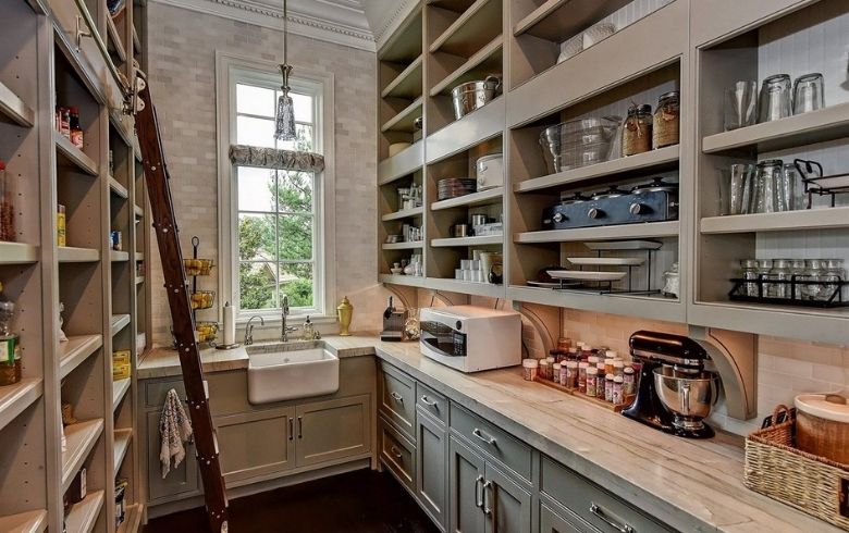 butler kitchen style walk-in pantry with small sink and and appliances