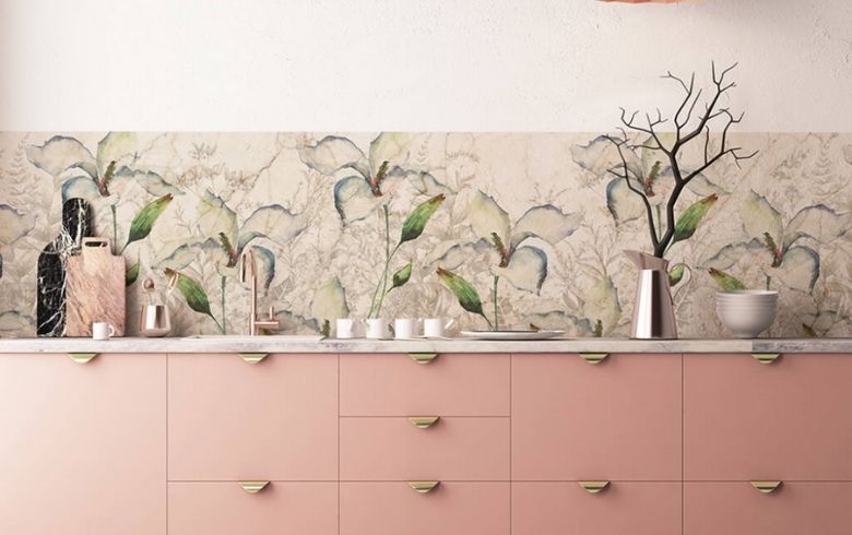 pink toned kitchen with gold handles and flower wallpapers for backsplash