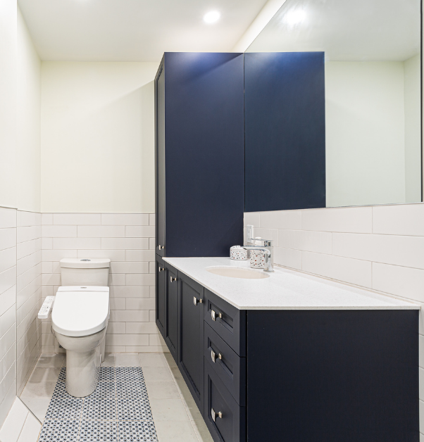 third renovated classic bathroom with dark blue vanity