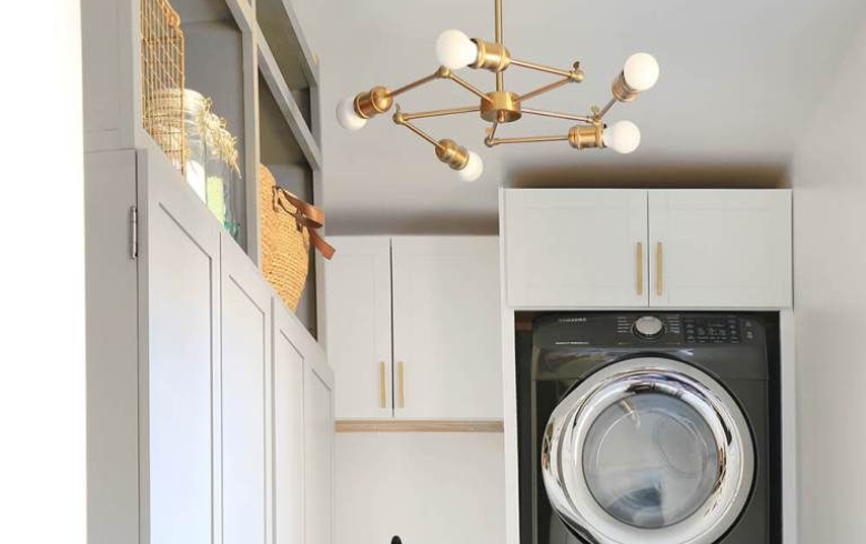 Laundry room with gold ceiling fixture