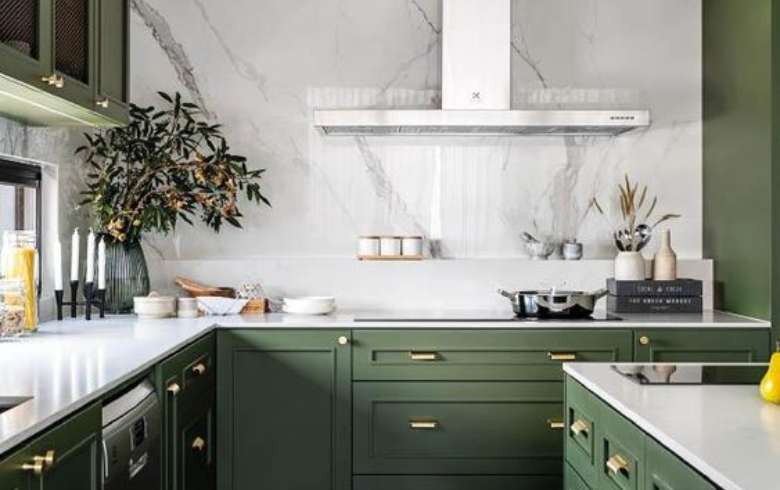 dark green kitchen white white resin backsplash that looks like marble