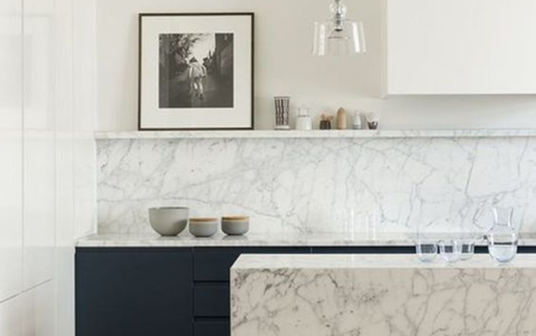 two-toned kitchen with white and grey marble counters and backsplash