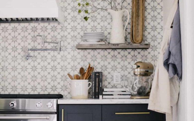kitchen with white and black mosaic tile backsplash