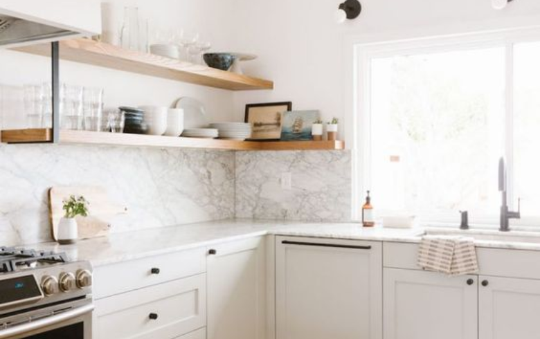 White kitchen with laminate marble backsplash