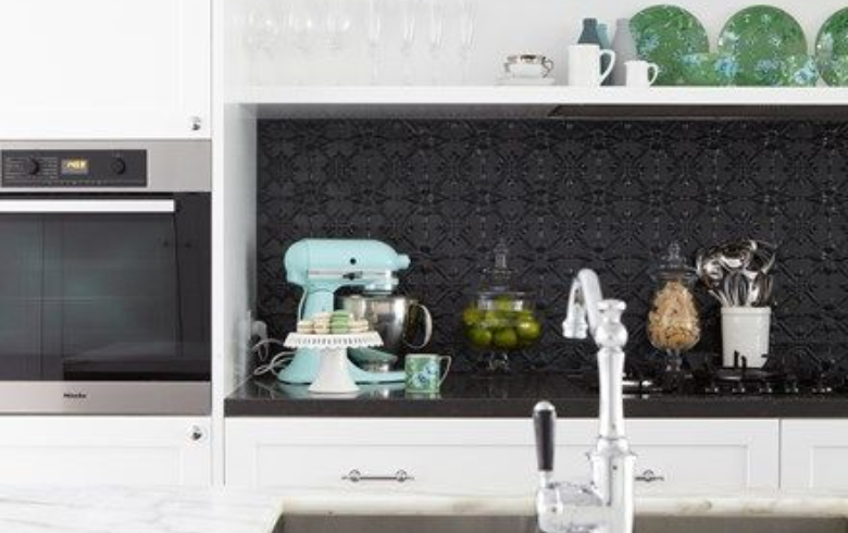white kitchen with black thermoplastic textured backsplash