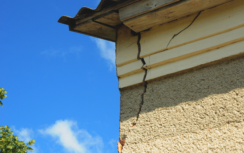 Siding corner of a house with a crack