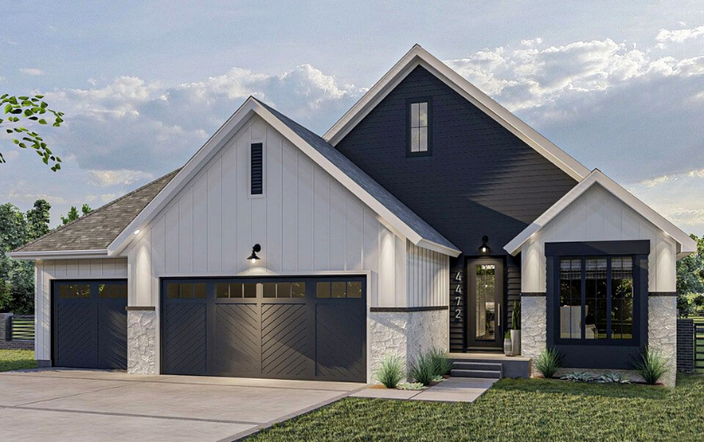 White farmhouse style house with two garages with black doors
