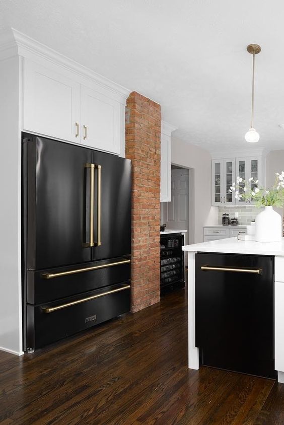 Extra-large black kitchen refrigerator in black and white kitchen