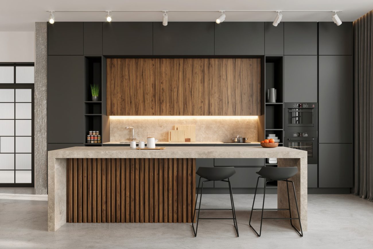 Modern kitchen with counter stools, black cabinets and large island with wood slats