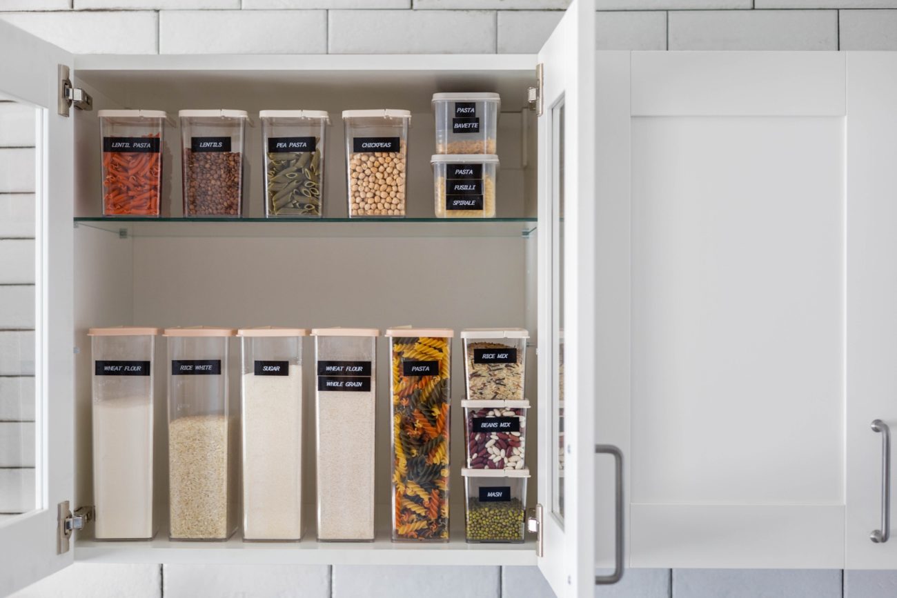 Organizing storage pots in a kitchen cabinet