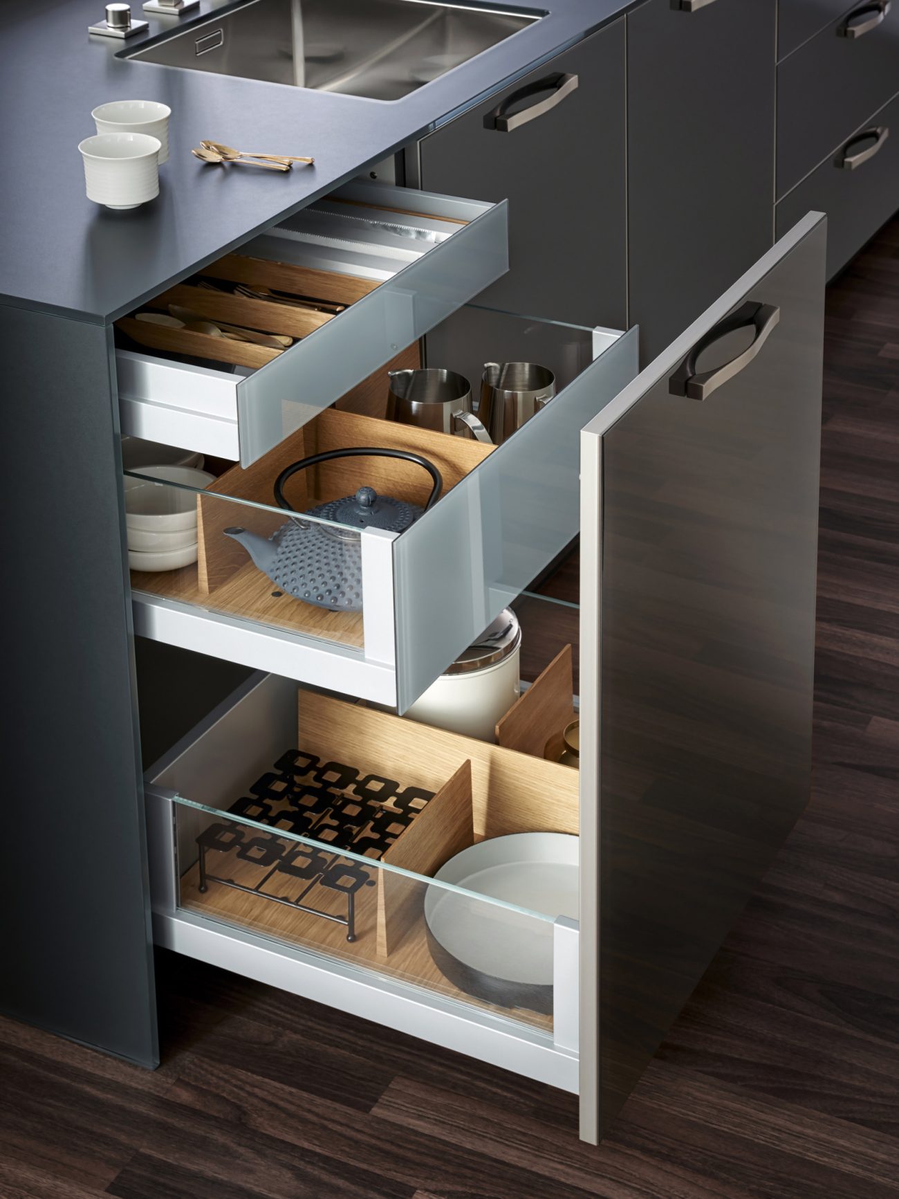 Pull-out drawers on a grey kitchen island