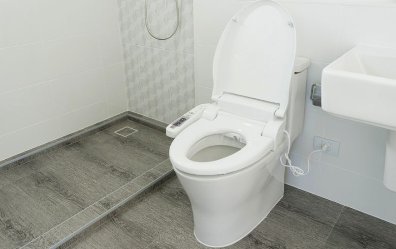 white toilet with bidet for limited mobility