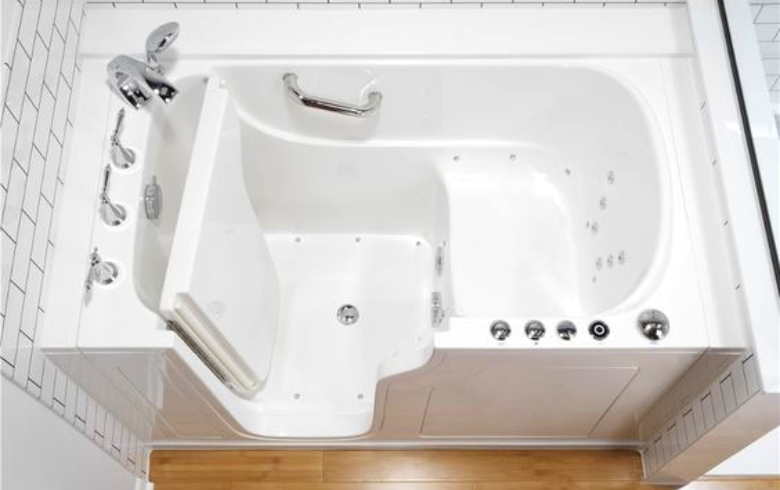 walk-in bath tub in with white tile wall