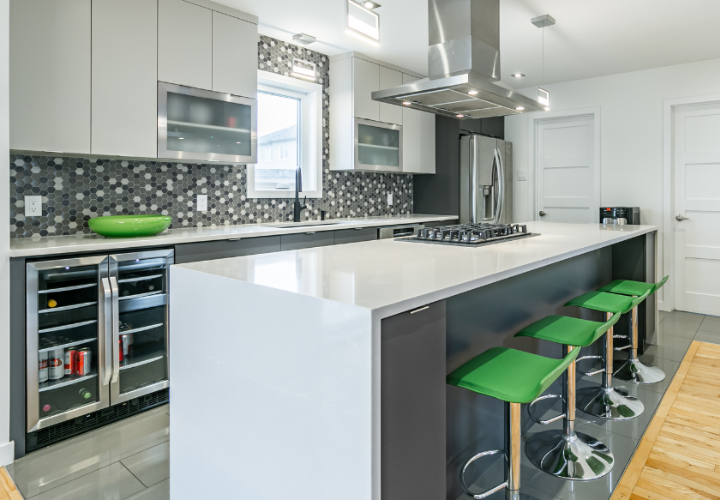 renovated kitchen white and grey with lime green stools after the transformation