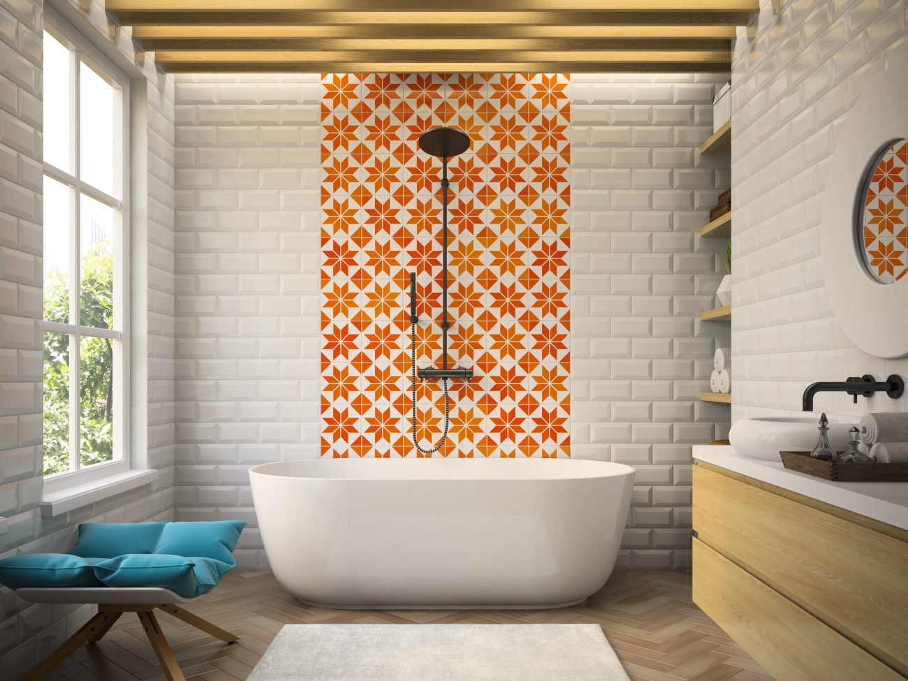 Bathroom in white brick, part of a wall in orange and white star-patterned tiles, oval bathtub, shower with black knob and low stool with blue cushion