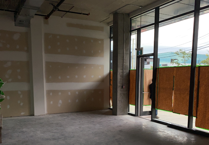 Clinic layout in progress with brown cardboard blocking windows