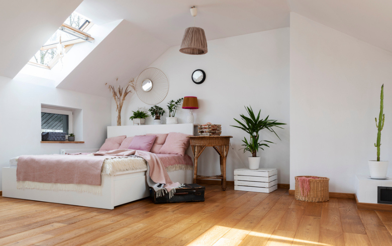 bedroom in attic with pink bedding
