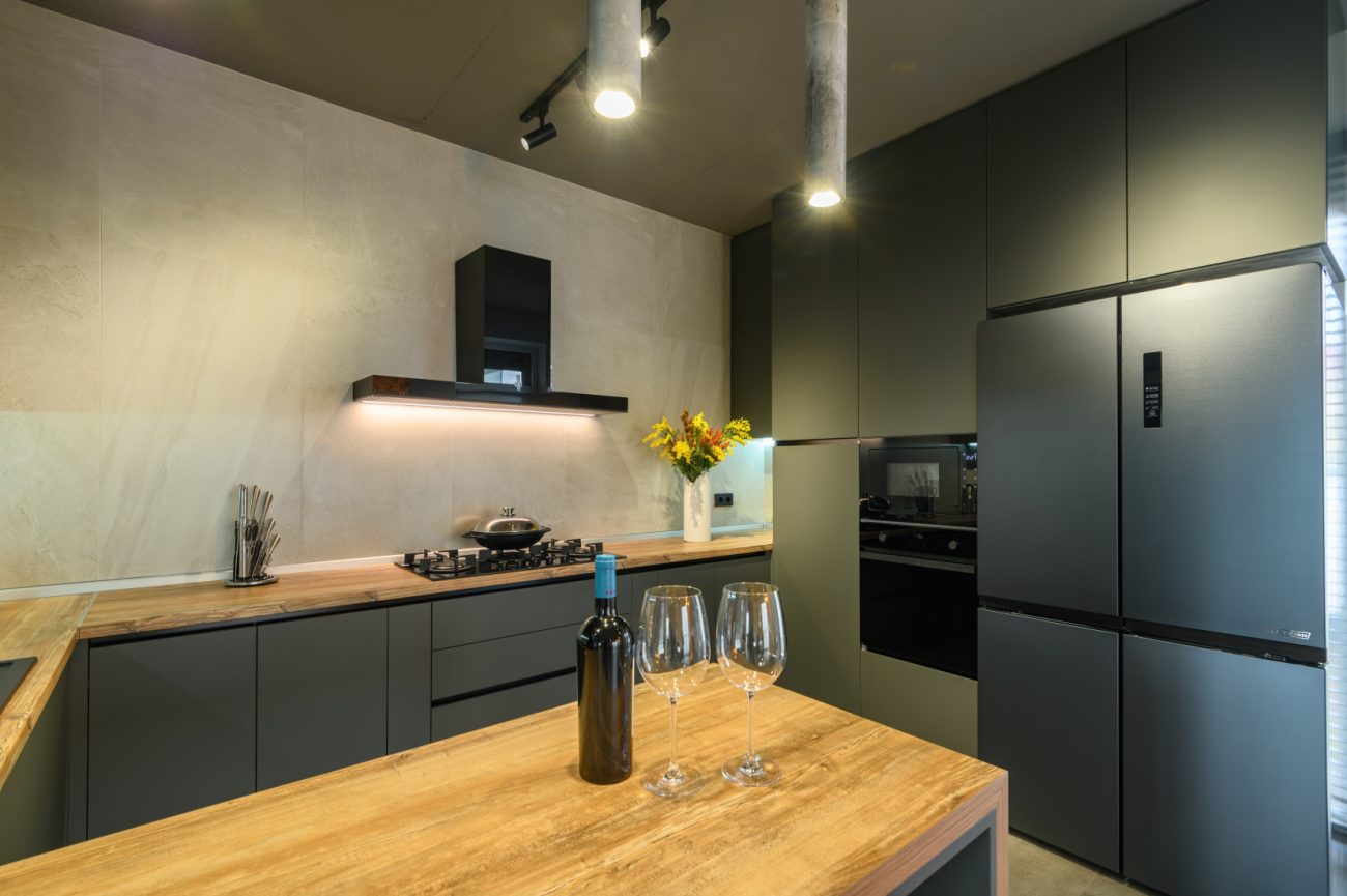 Modern luxury kitchen in dark grey with square hood