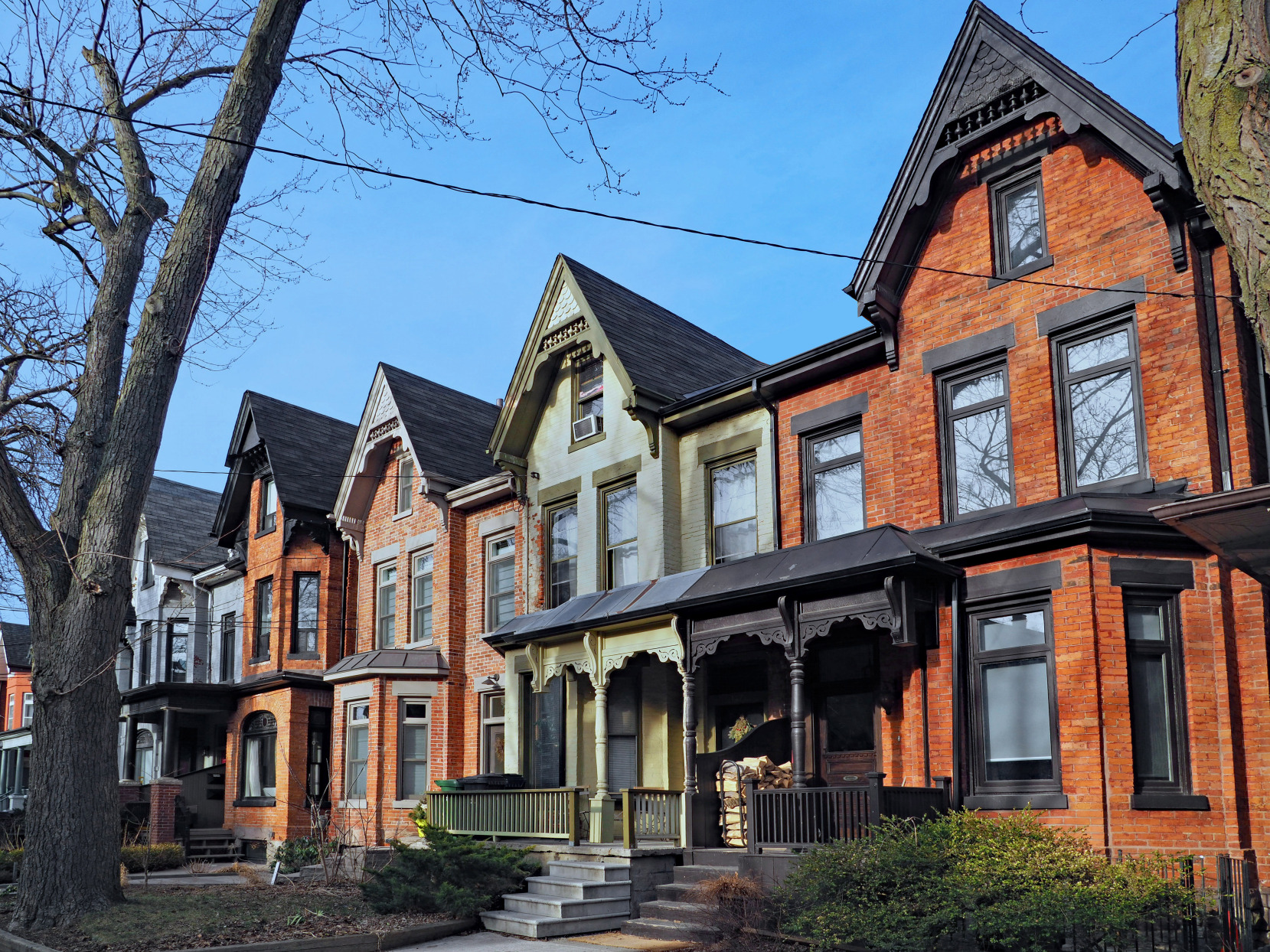 Row of old Victorian brick houses with gables