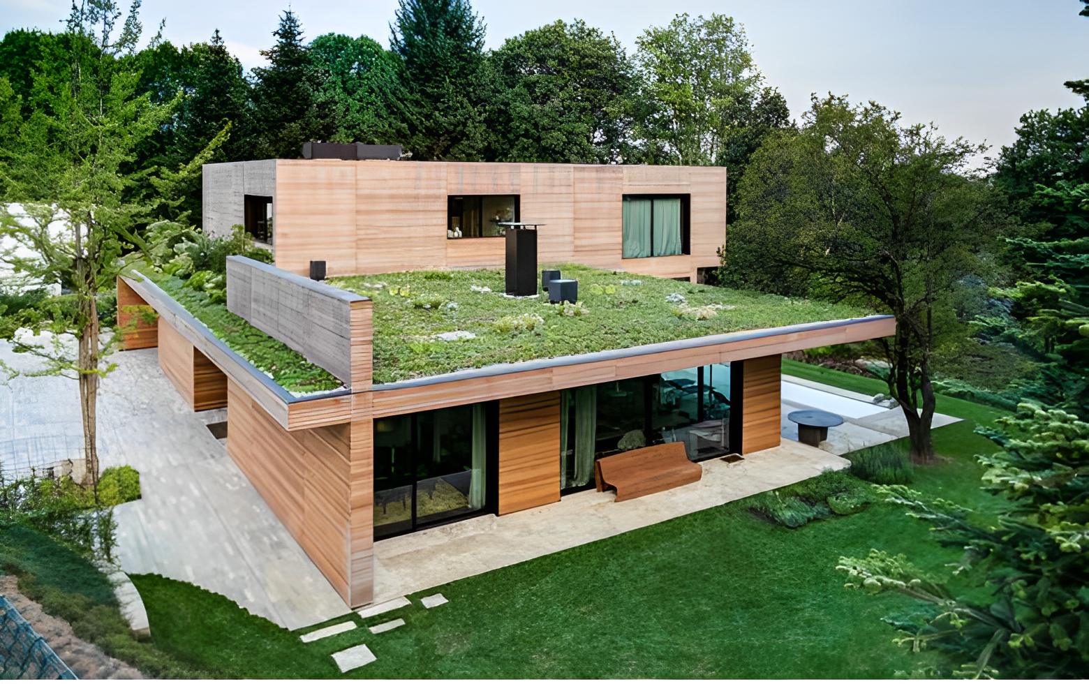 brown house with thin layer of grass on green roof