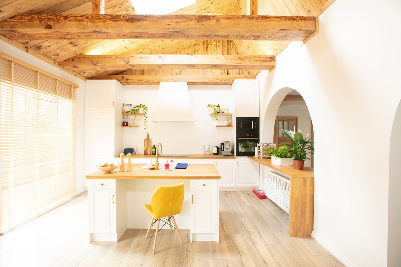 Wooden kitchen with high beam ceiling