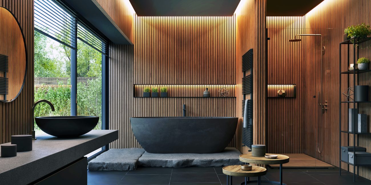 Salle de bain avec baignoire noire mate et petites bandes de bois sur les murs