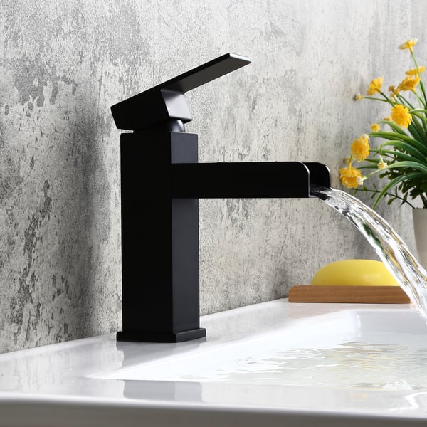 Black waterfall faucet installed on a sink