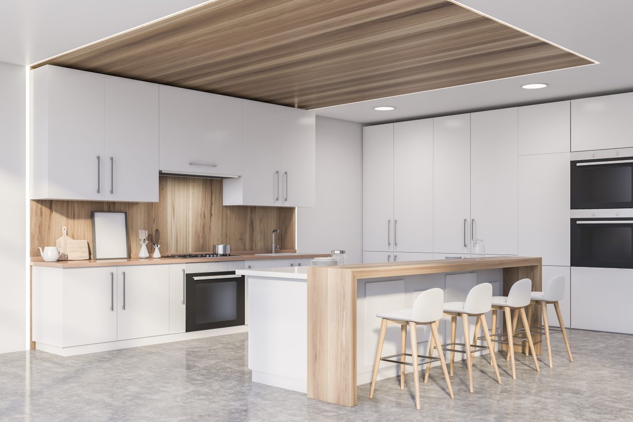 Kitchen in an open space apartment, white cabinets, wood ceiling, island with four bar stools